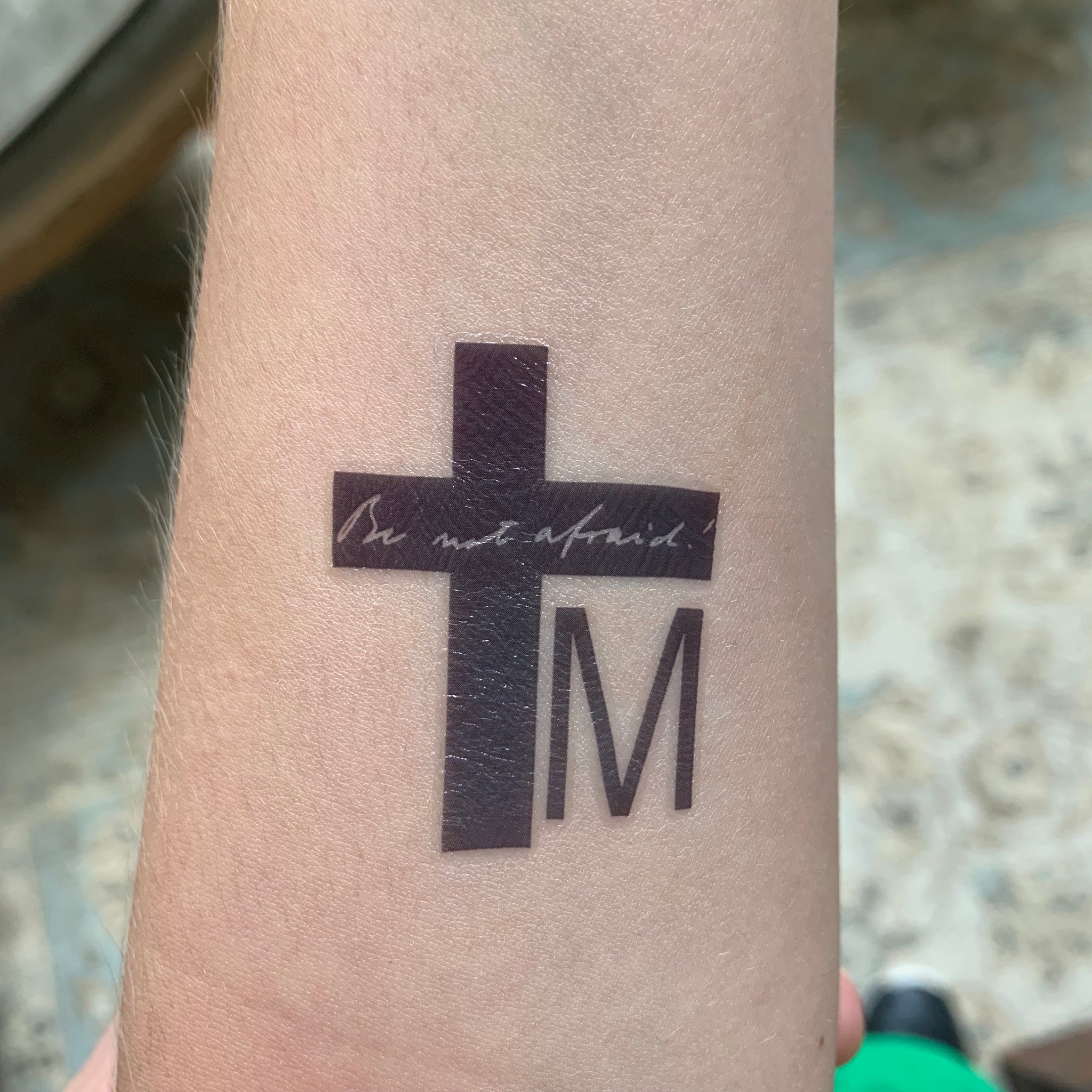 I found this cross when looking for good christian tattoo ideas does anyone  know what these signs at the bottom of the cross mean? : r/Christianity